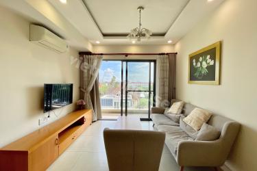 Minimalist Home with White and Wood Accents at Masteri Thao Dien