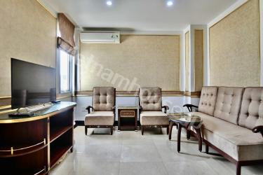 The serviced apartment with deep tones exudes luxury