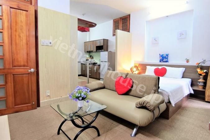 Two crimson heart-shaped pillows for dear customers in serviced apartment