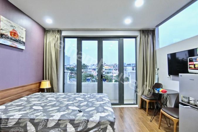 Affordable top floor serviced apartment near Nhieu Loc canal