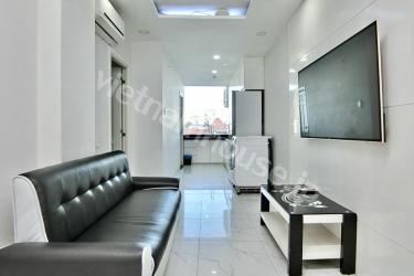 Unique L-shaped serviced apartment near Nhieu Loc canal